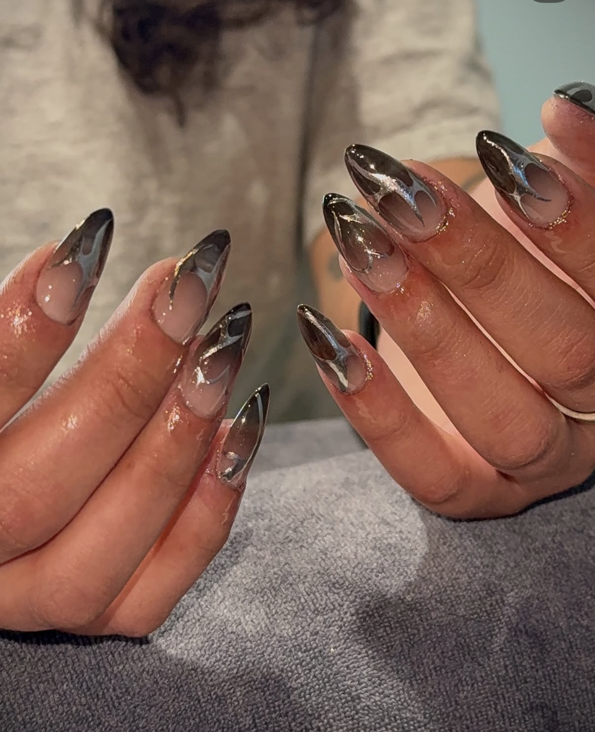 Intricate nail art with glossy finish